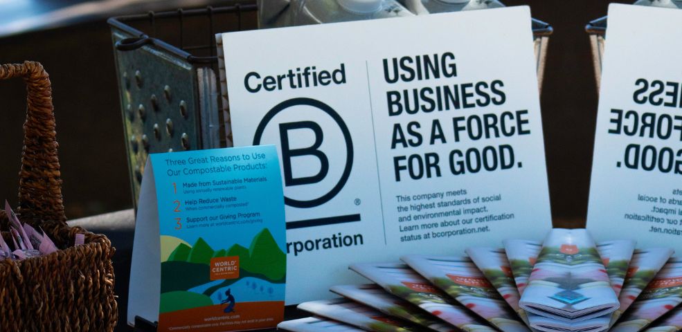 Amavida Coffee Roasters event table with Certified B Corp signage.